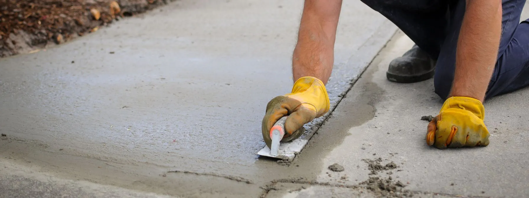 a contractor repairing concrete driveway in santa fe nm