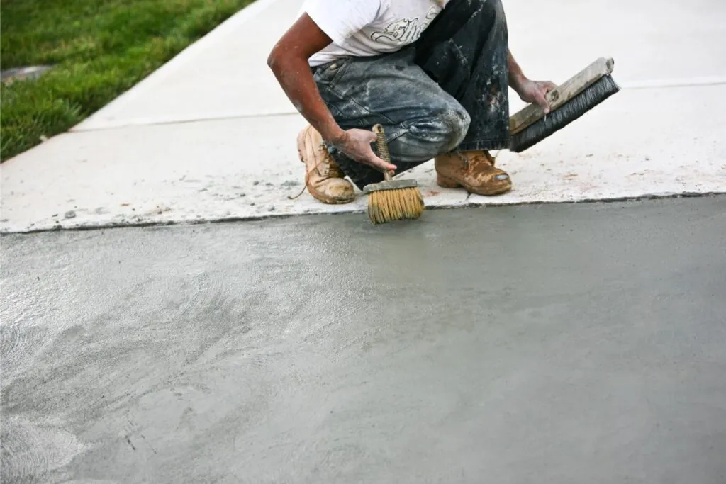 a contractor paving concrete driveway